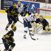Michigan freshman goaltender Steve Racine saves a puck as Notre Dame center Anders Lee shoots on Sunday, March 24. Daniel Brenner I AnnArbor.com